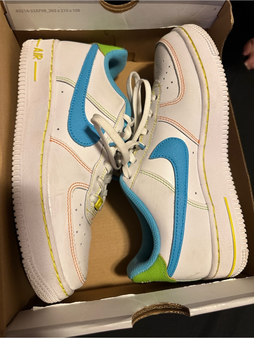 Nike White Low-Top Sneakers with Bright Blue Swoosh & Lime Heel